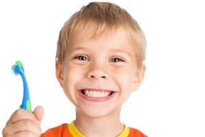 Photo of a Smiling Child Holding a Toothbrush